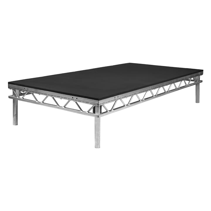 A low, rectangular portable stage platform with a black surface and silver metal truss legs, designed for events or performances, ideal for supporting lighting and audio equipment.