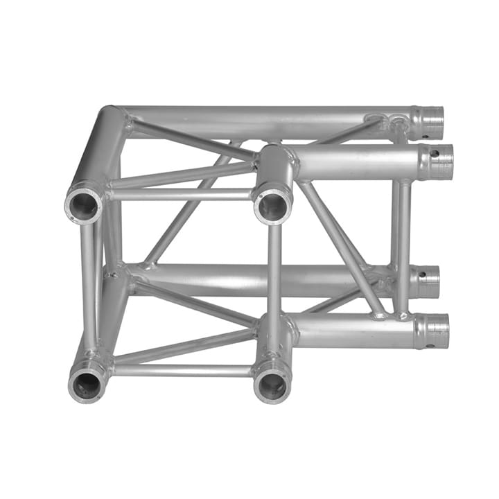 A silver metal truss connector with four cylindrical ends and triangular support structures, designed for joining tubes in stage, audio, or lighting setups.