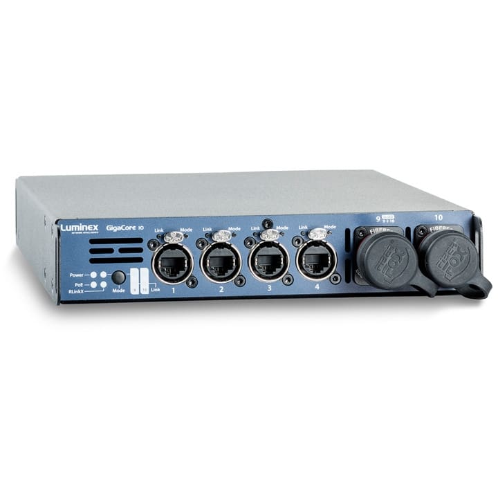 Front view of a Luminex GigaCore 10 network switch, ideal for lighting, video, and audio setups, featuring four Ethernet ports, LED indicators, and two covered fiber optic ports on a metallic gray rectangular device.