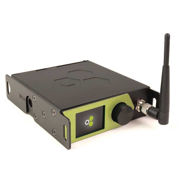 A compact black and green electronic device with a small display screen, control knob, antenna, and various ports, ideal for wireless audio or lighting control applications.