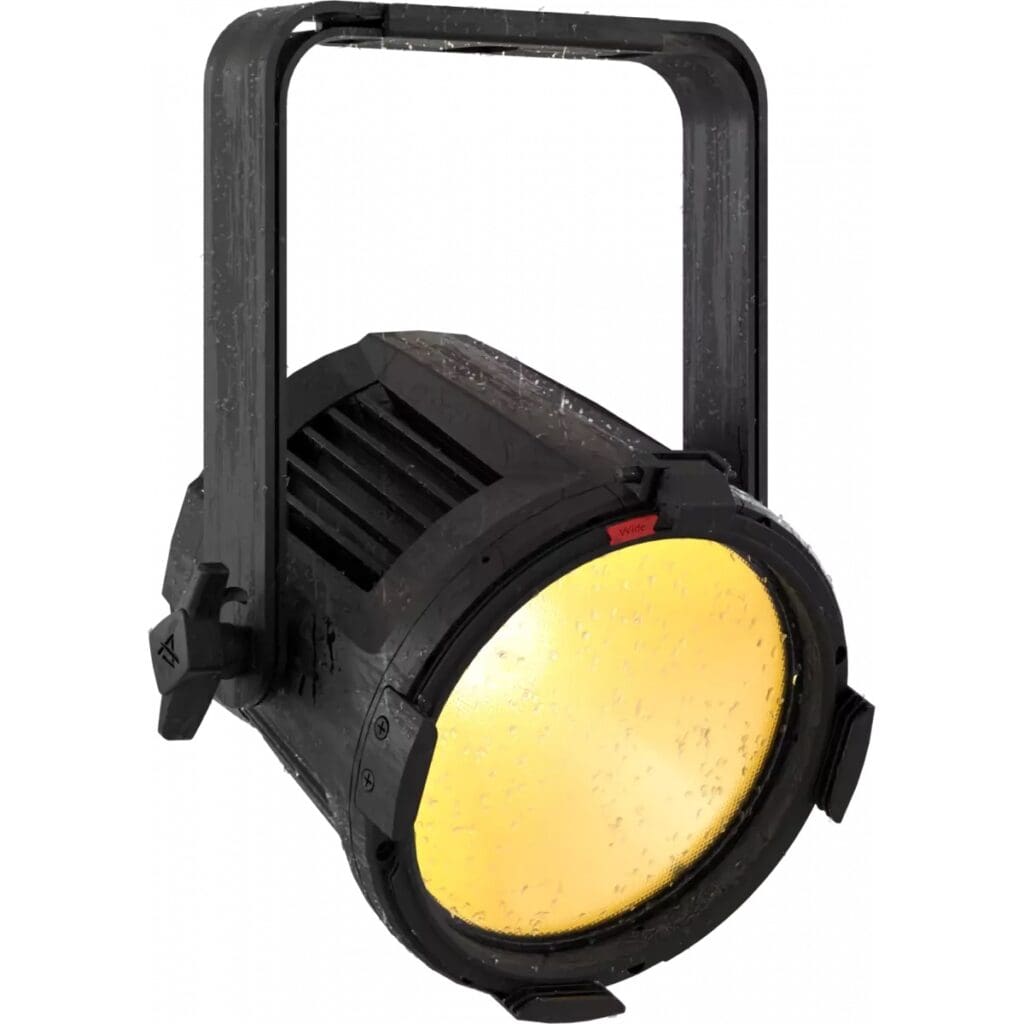 A black stage light for professional lighting, featuring a yellow glowing lens speckled with water droplets and a sturdy handle on top for mounting or adjustment.