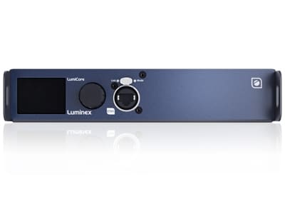 Front view of a Luminex LumiCore network device featuring a display screen, rotary control, network port, and status indicator lights on a sleek blue and black rectangular panel for video, lighting, and audio applications.
