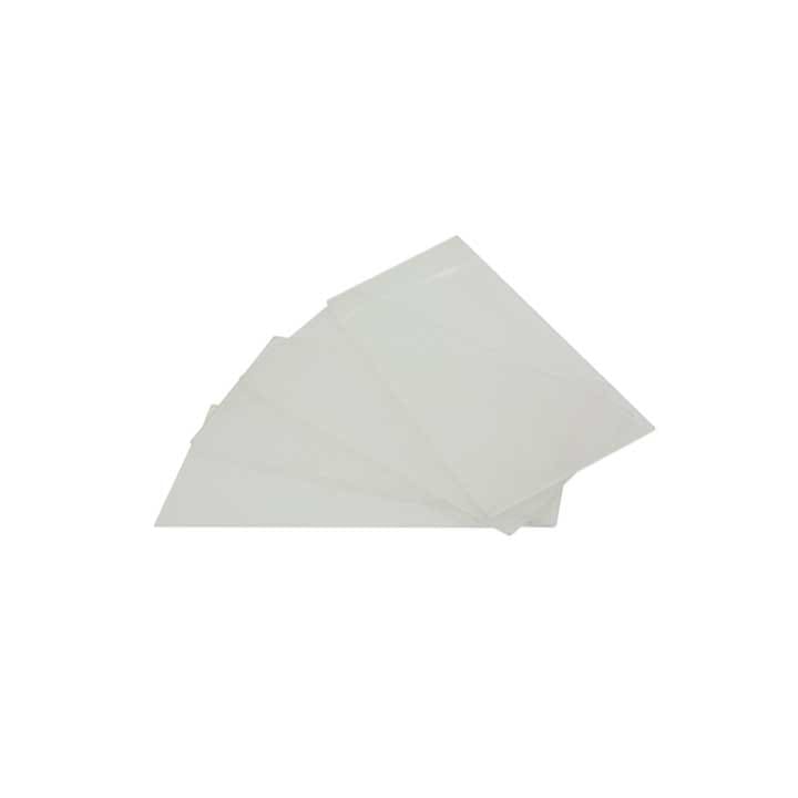 Four transparent plastic sheets are stacked slightly askew on a plain white background, with the lighting highlighting their clean edges and sleek surface.
