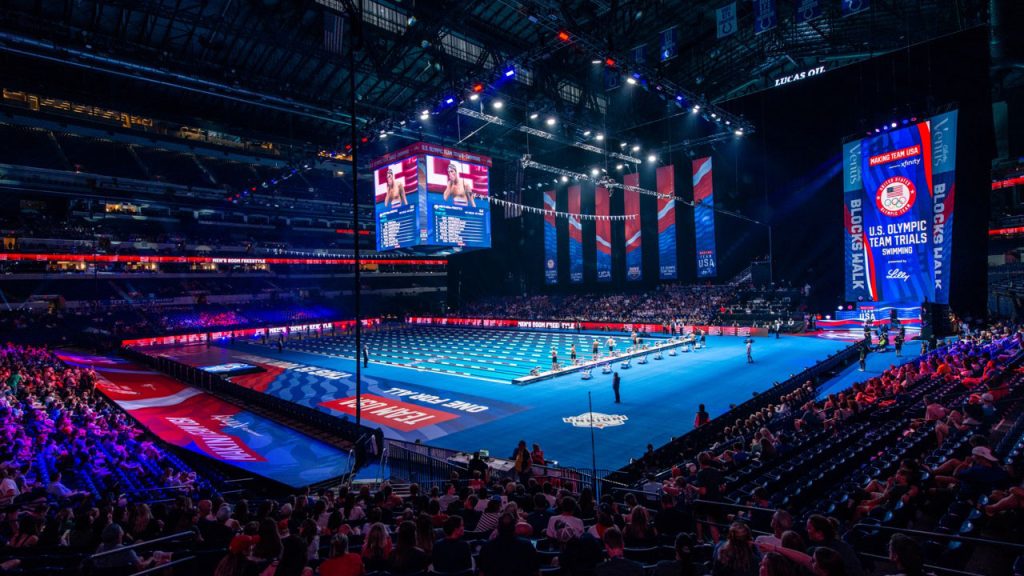 The USA 2024 Olympic Swim Trials transformed the Lucas Oil Stadium in Indianapolis. Image of an Indoor swimming pool in a stadium.